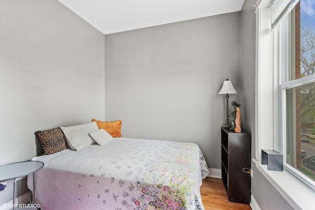 2416 N Avers Ave, Chicago, IL 60647 - bedroom with light wood-style floors and baseboards