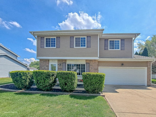 2675 Dorothy Dr, Aurora, IL 60504 - view of front of house featuring brick siding, concrete driveway, and a garage
