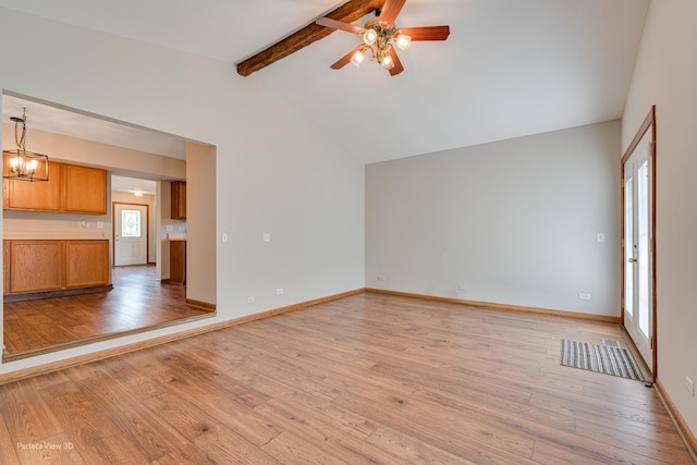 2675 Dorothy Dr, Aurora, IL 60504 - unfurnished living room featuring light wood-style floors, a ceiling fan, baseboards, and a chandelier