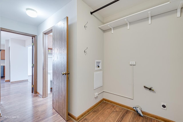 2675 Dorothy Dr, Aurora, IL 60504 - laundry room featuring light wood-type flooring, washer hookup, electric dryer hookup, and baseboards