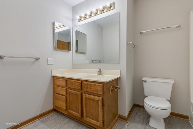 2675 Dorothy Dr, Aurora, IL 60504 - bathroom with toilet, baseboards, and vanity