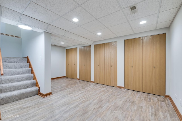 2675 Dorothy Dr, Aurora, IL 60504 - finished basement with wood finished floors, baseboards, stairway, recessed lighting, and a paneled ceiling
