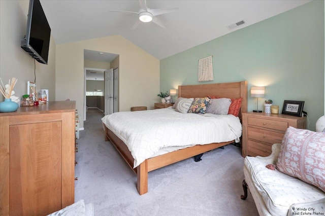 bedroom featuring carpet flooring, vaulted ceiling, and a ceiling fan