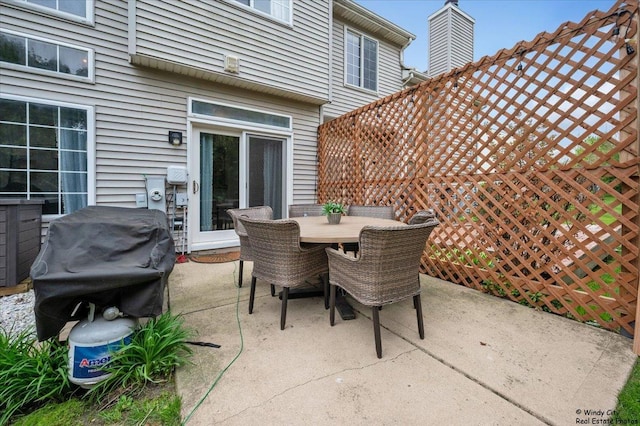view of patio / terrace featuring outdoor dining space and grilling area