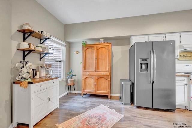 kitchen with stainless steel fridge with ice dispenser, white electric stove, light wood-type flooring, open shelves, and white cabinets