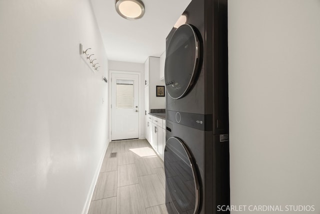 833 Shiloh Cir, Naperville, IL 60540 - laundry area with stacked washer / dryer and baseboards
