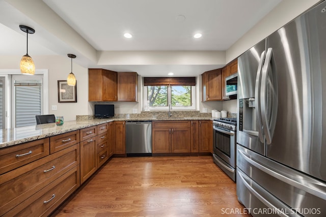 833 Shiloh Cir, Naperville, IL 60540 - kitchen featuring appliances with stainless steel finishes, a sink, brown cabinetry, hanging light fixtures, and recessed lighting