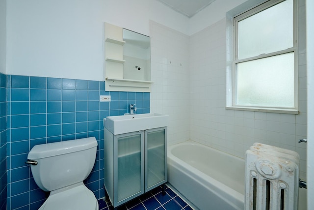 5060 N Claremont Ave Unit 2W, Chicago, IL 60625 - full bathroom with radiator, tile walls, tile patterned flooring, toilet, and a tub to relax in