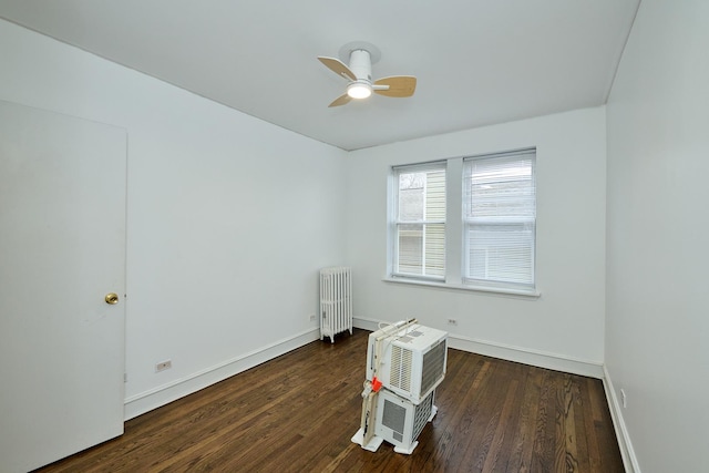 5060 N Claremont Ave Unit 2W, Chicago, IL 60625 - spare room featuring radiator heating unit, wood finished floors, baseboards, and a ceiling fan