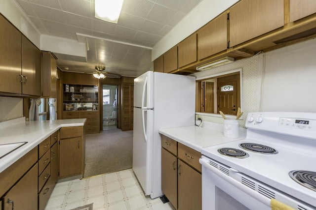 6305 247th Ave, Paddock Lake, WI 53168 - kitchen featuring white appliances, light floors, light countertops, and a ceiling fan