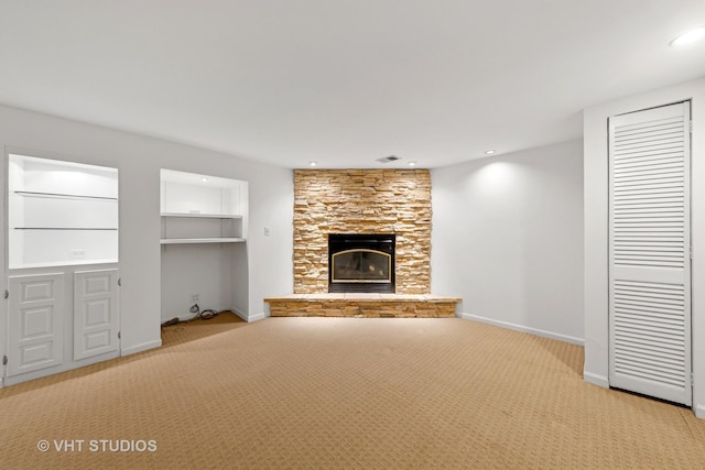 3913 N Kedvale Ave Unit A, Chicago, IL 60641 - unfurnished living room with carpet floors, a stone fireplace, baseboards, and recessed lighting