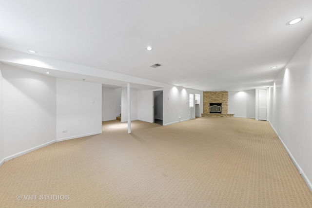 3913 N Kedvale Ave Unit A, Chicago, IL 60641 - finished below grade area with light carpet, baseboards, a fireplace, and recessed lighting
