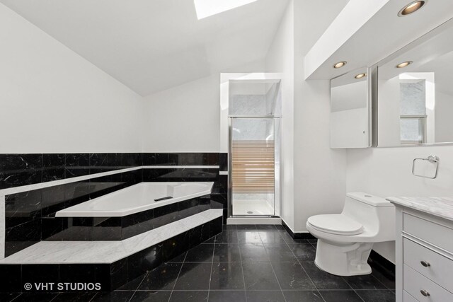 3913 N Kedvale Ave Unit A, Chicago, IL 60641 - bathroom with toilet, vanity, tile patterned floors, recessed lighting, and a shower stall