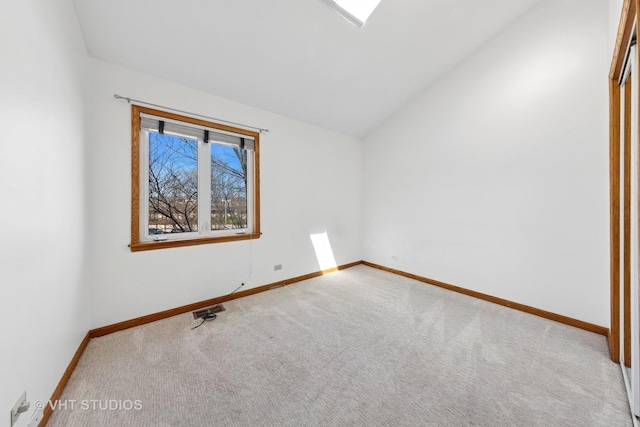 3913 N Kedvale Ave Unit A, Chicago, IL 60641 - unfurnished room with carpet flooring, vaulted ceiling, and baseboards