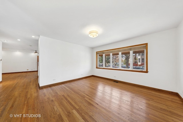 3913 N Kedvale Ave Unit A, Chicago, IL 60641 - empty room with baseboards, wood finished floors, and recessed lighting