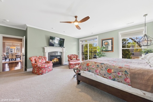 149 W Kennedy Ln Unit 208, Hinsdale, IL 60521 - carpeted bedroom with crown molding, a fireplace with flush hearth, multiple windows, access to exterior, and a chandelier