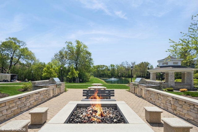 149 W Kennedy Ln Unit 208, Hinsdale, IL 60521 - view of patio / terrace featuring an outdoor kitchen, an outdoor fire pit, a water view, and grilling area