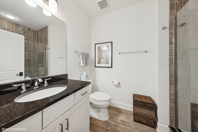 149 W Kennedy Ln Unit 208, Hinsdale, IL 60521 - full bath featuring a shower stall, wood finished floors, toilet, vanity, and baseboards