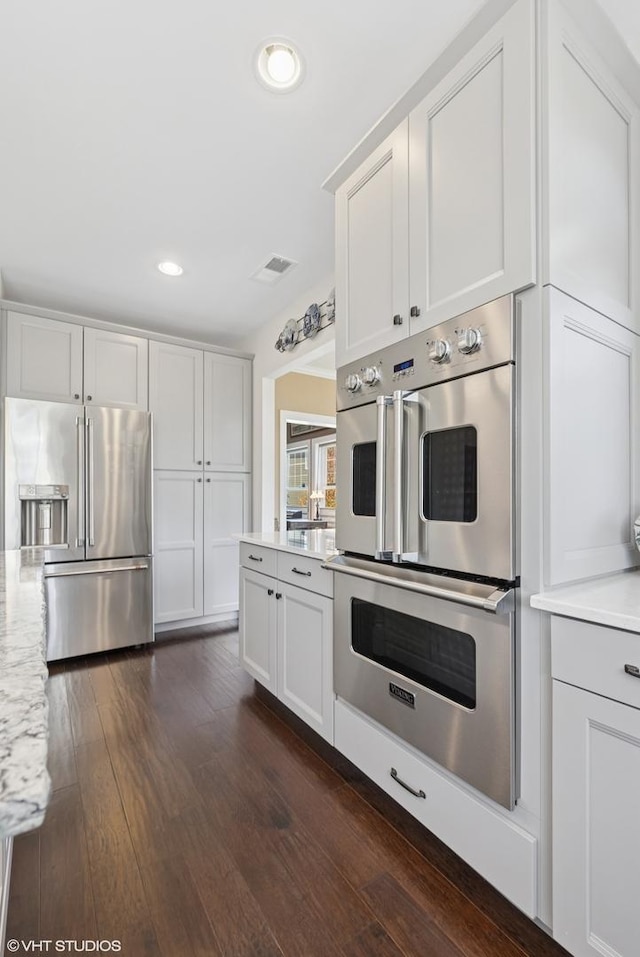 149 W Kennedy Ln Unit 208, Hinsdale, IL 60521 - kitchen featuring appliances with stainless steel finishes, recessed lighting, dark wood-style flooring, and white cabinets
