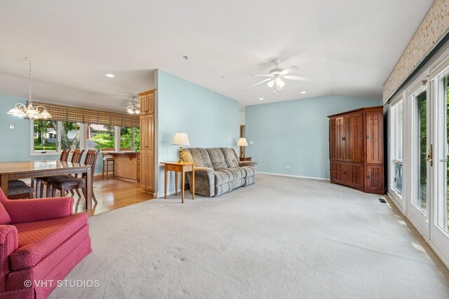 907 Division St, Barrington, IL 60010 - living room featuring light carpet, a ceiling fan, lofted ceiling, a chandelier, and recessed lighting
