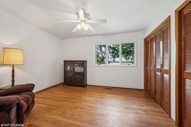 907 Division St, Barrington, IL 60010 - living room featuring light wood finished floors and a ceiling fan