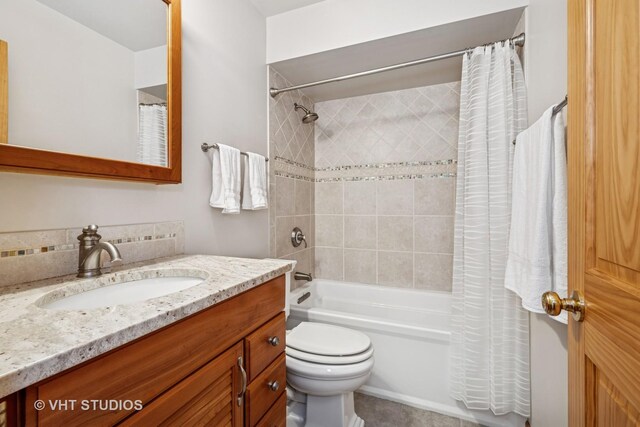 907 Division St, Barrington, IL 60010 - full bath featuring vanity, shower / tub combo with curtain, and tile patterned flooring