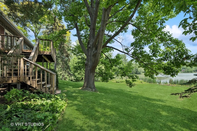 907 Division St, Barrington, IL 60010 - view of green lawn featuring stairway and a deck with water view