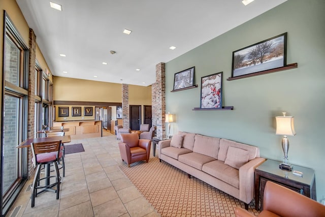 living room with light tile patterned flooring and recessed lighting
