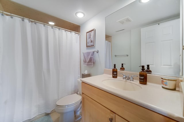 full bathroom featuring toilet and vanity