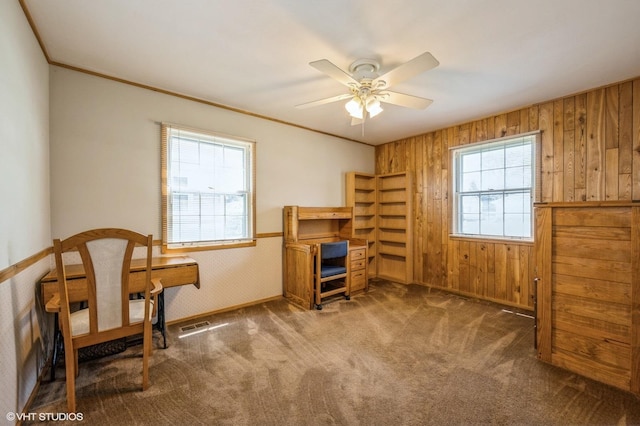 830 Silver Rock Ln, Buffalo Grove, IL 60089 - sitting room featuring wood walls, a ceiling fan, carpet floors, baseboards, and crown molding