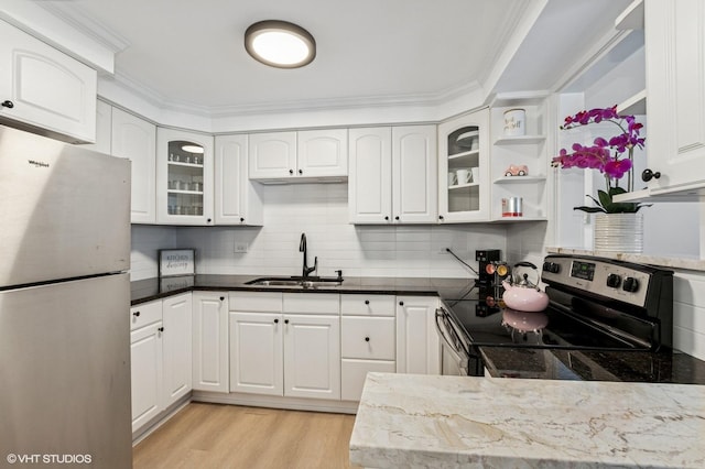 1009 8th Ave Unit 15-4, La Grange, IL 60525 - kitchen featuring appliances with stainless steel finishes, a sink, light wood-style flooring, white cabinets, and glass insert cabinets
