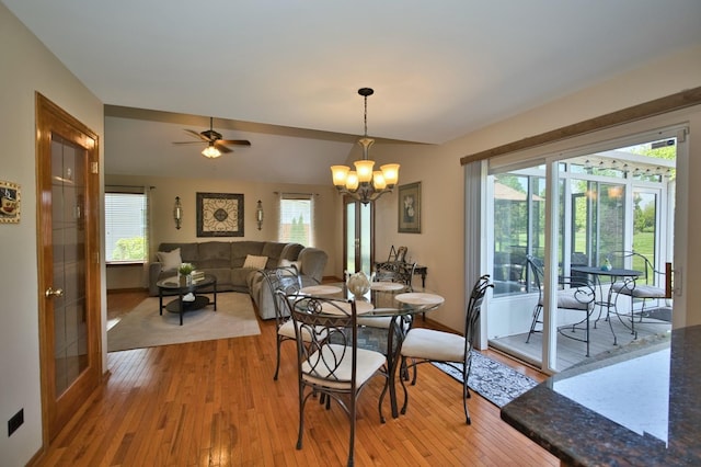 1729 Hidden Oaks Ct, Plainfield, IL 60586 - dining room with light wood-style flooring, a chandelier, and a ceiling fan