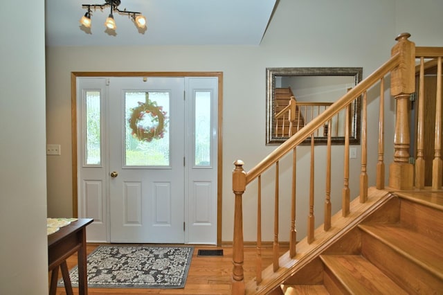 1729 Hidden Oaks Ct, Plainfield, IL 60586 - foyer entrance featuring stairs, wood finished floors, and a chandelier