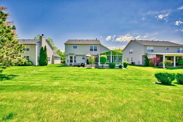 1729 Hidden Oaks Ct, Plainfield, IL 60586 - back of property featuring a sunroom and a lawn
