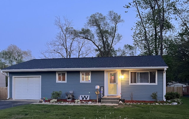 210 E Edgelawn Dr, Plano, IL 60545 - view of front facade with a garage and asphalt driveway