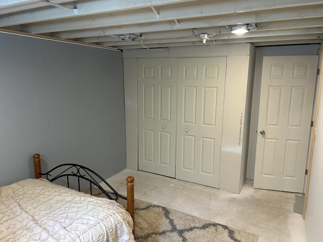 210 E Edgelawn Dr, Plano, IL 60545 - bedroom featuring concrete floors and a closet