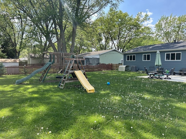 210 E Edgelawn Dr, Plano, IL 60545 - view of yard featuring a playground and cooling unit