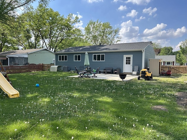 210 E Edgelawn Dr, Plano, IL 60545 - rear view of house featuring central AC, a patio area, and a playground