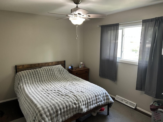 210 E Edgelawn Dr, Plano, IL 60545 - bedroom featuring baseboards, a ceiling fan, and carpet flooring