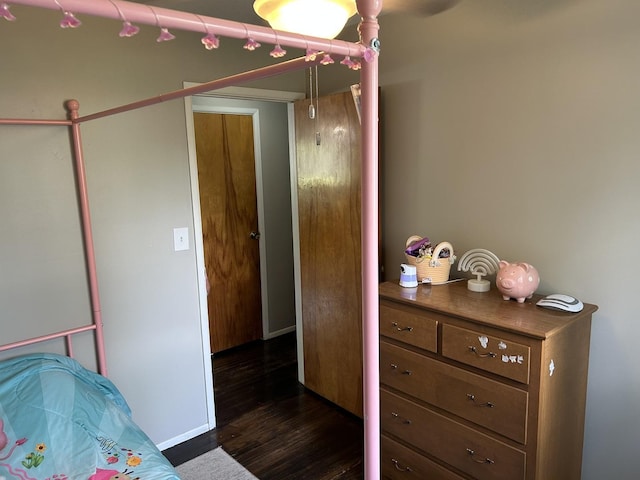 210 E Edgelawn Dr, Plano, IL 60545 - bedroom featuring dark wood-type flooring and baseboards