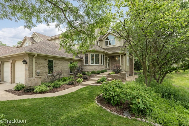 2325 Durand Dr, Downers Grove, IL 60515 - view of front of home featuring an attached garage, a shingled roof, brick siding, a front lawn, and concrete driveway