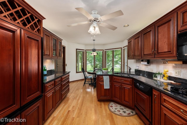 2325 Durand Dr, Downers Grove, IL 60515 - kitchen featuring black appliances, backsplash, light wood-style flooring, a peninsula, and recessed lighting