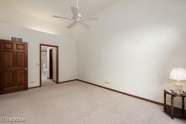 2325 Durand Dr, Downers Grove, IL 60515 - unfurnished bedroom with light colored carpet, high vaulted ceiling, connected bathroom, and a ceiling fan