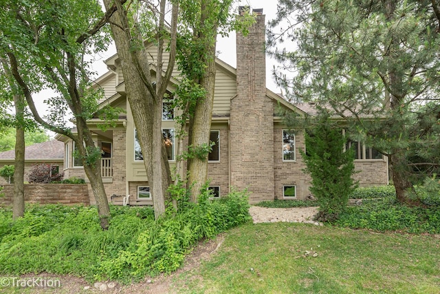 2325 Durand Dr, Downers Grove, IL 60515 - view of side of home with a chimney, brick siding, and a yard