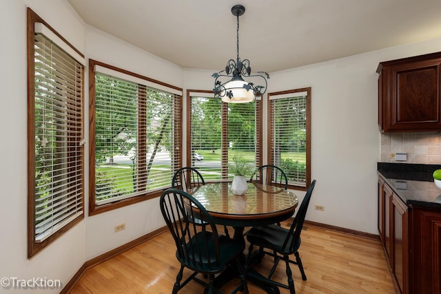 2325 Durand Dr, Downers Grove, IL 60515 - dining area featuring a chandelier and light wood-type flooring