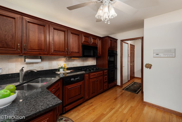 2325 Durand Dr, Downers Grove, IL 60515 - kitchen featuring black appliances, backsplash, ceiling fan, light wood-style flooring, and dark stone counters