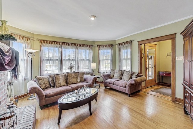 2742 N 76th Ct, Elmwood Park, IL 60707 - living area with healthy amount of natural light, light wood-type flooring, and ornamental molding