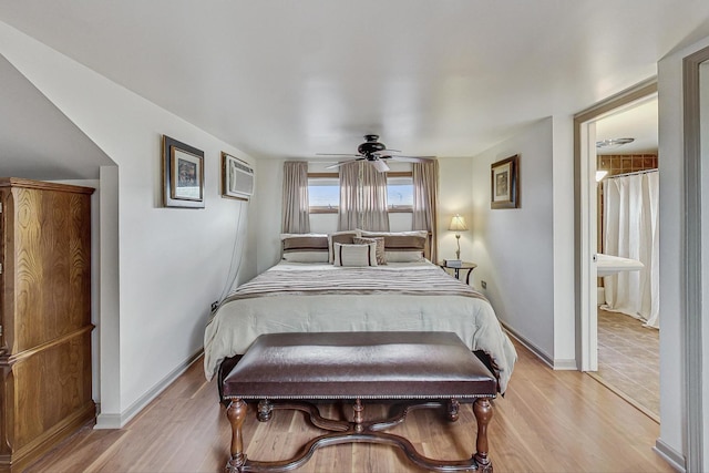 2742 N 76th Ct, Elmwood Park, IL 60707 - bedroom featuring light wood-style flooring, baseboards, and an AC wall unit