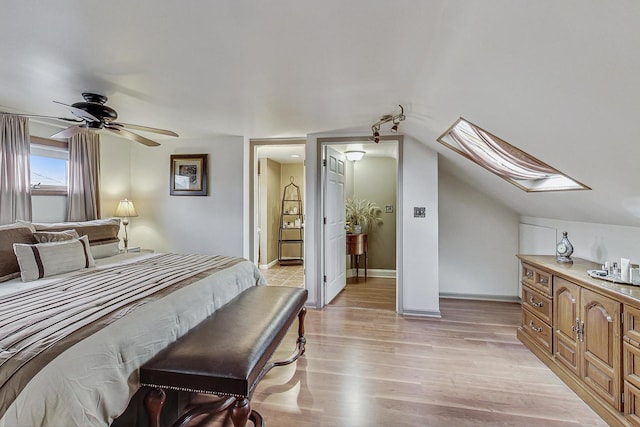 2742 N 76th Ct, Elmwood Park, IL 60707 - bedroom with a skylight, light wood-style floors, baseboards, and ensuite bathroom