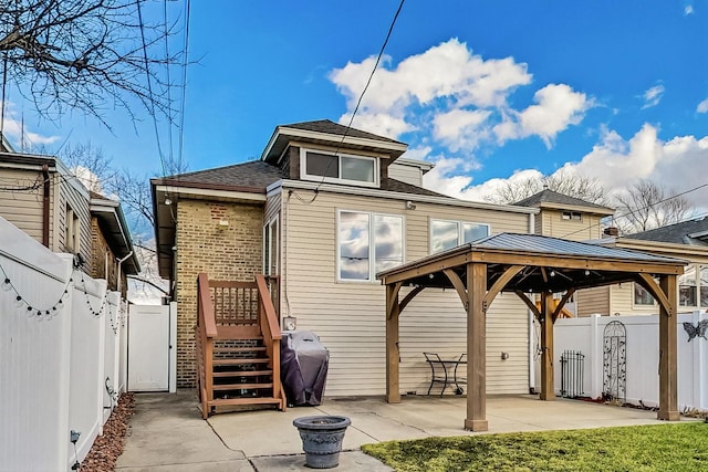 2742 N 76th Ct, Elmwood Park, IL 60707 - back of property with a gazebo, fence, a patio area, and a shingled roof